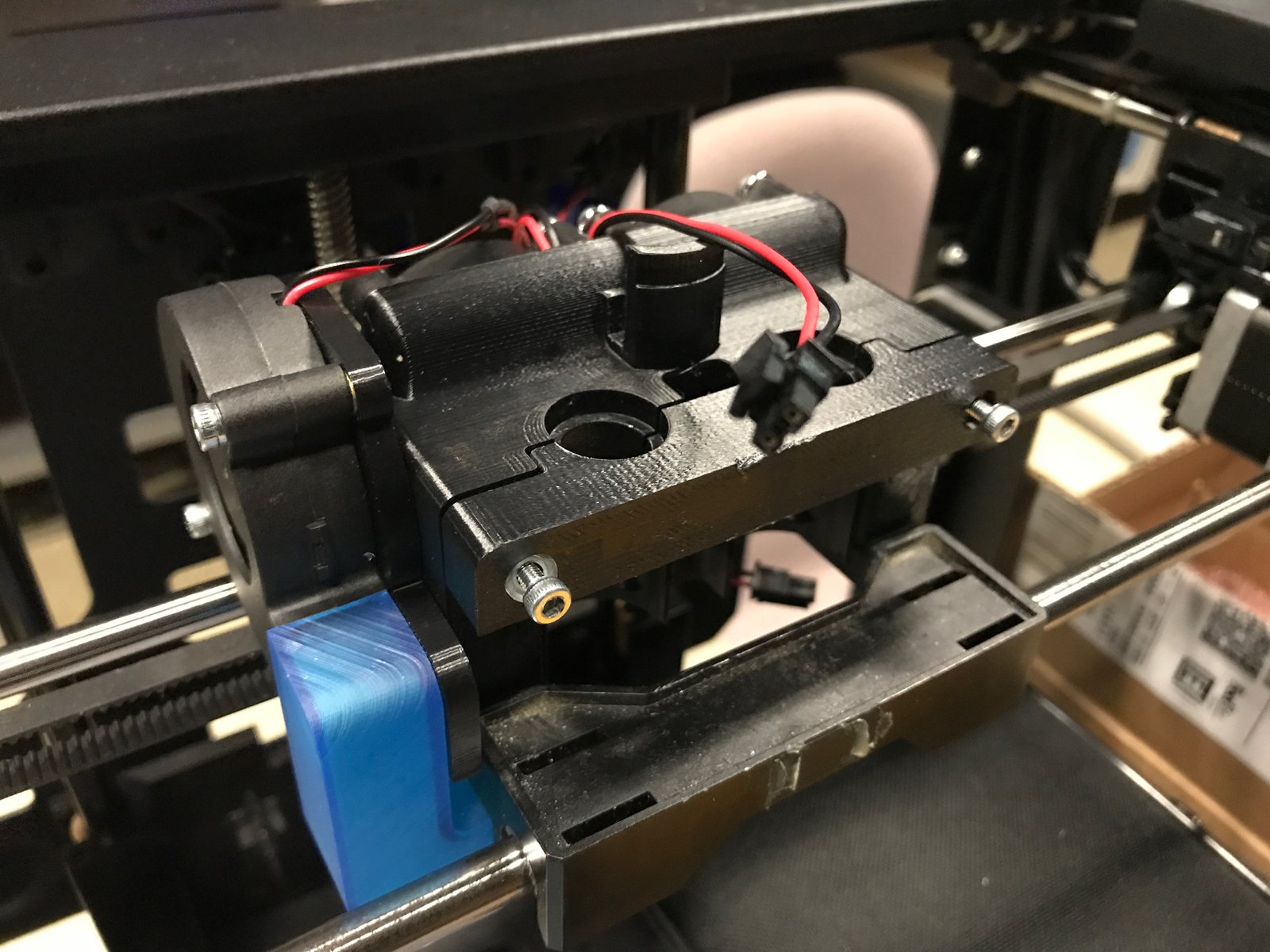  A PLA prototype of the carriage frame and bracket, with the tool and part cooling fans installed. The part cooling duct is printed with Tough Resin on a Form 2, as it's the only prniter capible of printing hollow parts with fine details. 