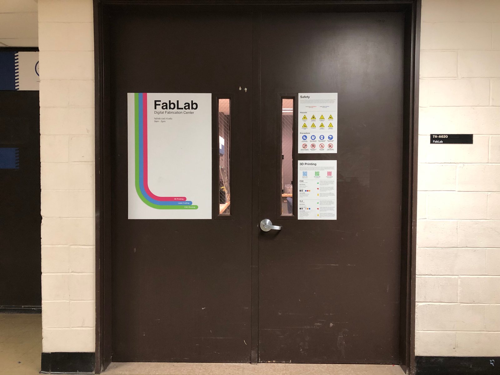  Entrace to the lab, featuring posters directing students to online resources and guides. 